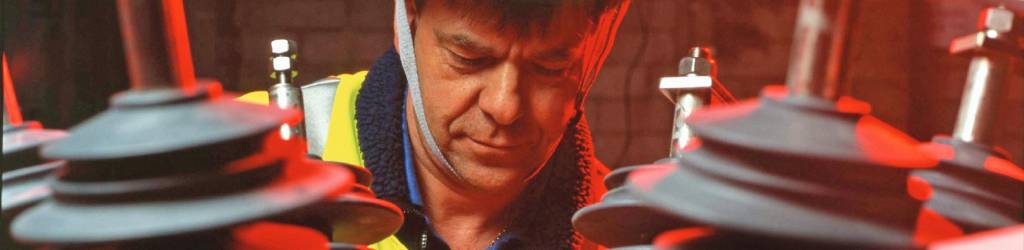 Engineer performing EMF site survey on transformer Engineer performing EMF site survey on transformer